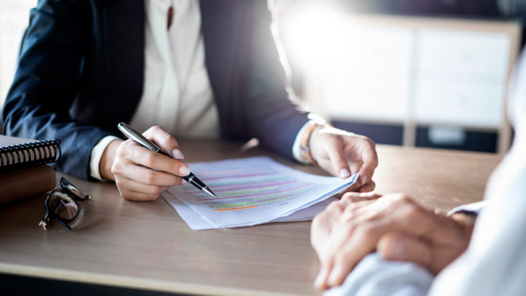 a man signing a document